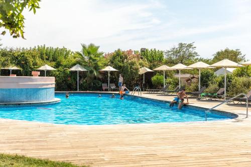 a group of people in a swimming pool at Camping Alannia El Pinar in Blanes