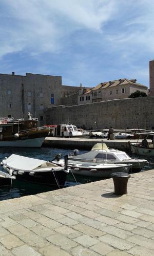 a group of boats are docked in a harbor at Apartmani Vila Marija in Budva