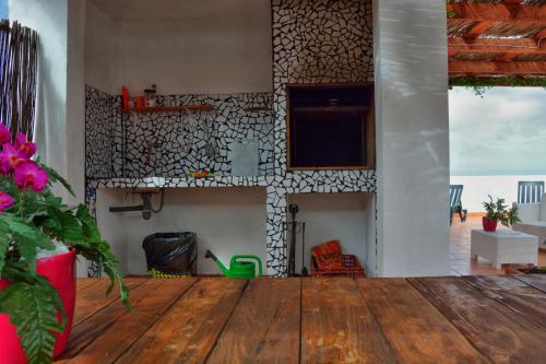a living room with a wooden table and a fireplace at Casa Yoel in Granadilla de Abona