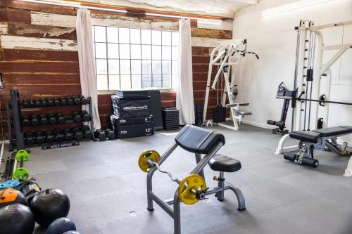 a gym with dumbbells and weights in a room at Gomocita Casita 3 at The Halles Artisan Venue in Round Top