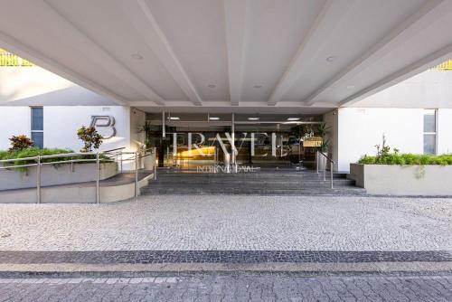 a lobby of a building with stairs and a building at Barra Palace Hotel in Rio de Janeiro