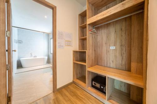 a bathroom with a shower and a sink at Bang tao modern holiday style pool view high speed WiFi in Laguna Phuket