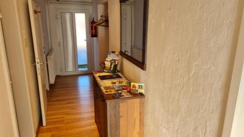a hallway with a counter and a mirror on a wall at Urlaubsnest in Harbach