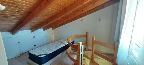 a small room with a bed and a bunk bed at Harmony 3 in Artemida