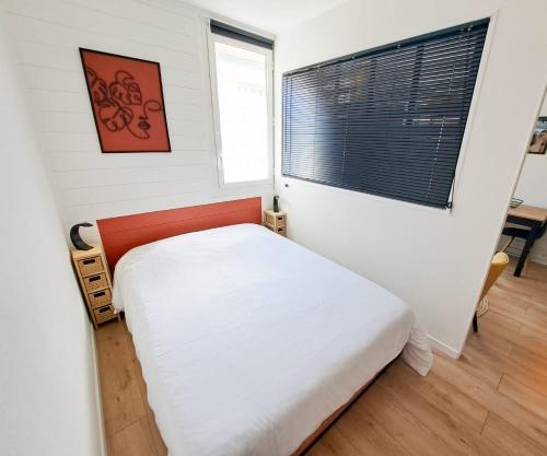 Een bed of bedden in een kamer bij Les Amoureux