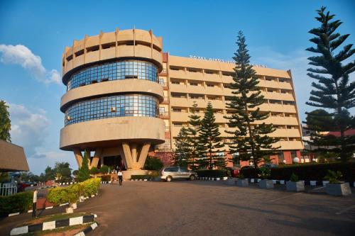 a large building with a round building at Royalbirds Hotel & Towers in Akure