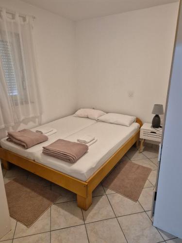 Katil atau katil-katil dalam bilik di Apartmani Hrc