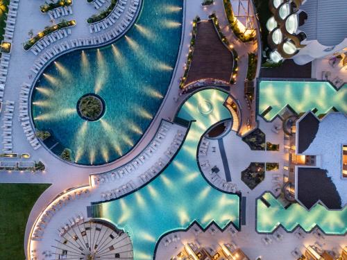 a rendering of a water park with a roller coaster at Liberty Signa in Fethiye