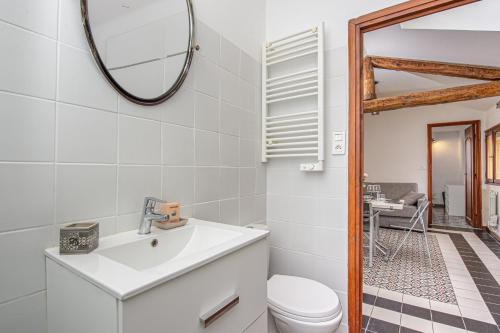 a bathroom with a sink and a mirror at Bastion Ideally located, brightness, sea views in Menton