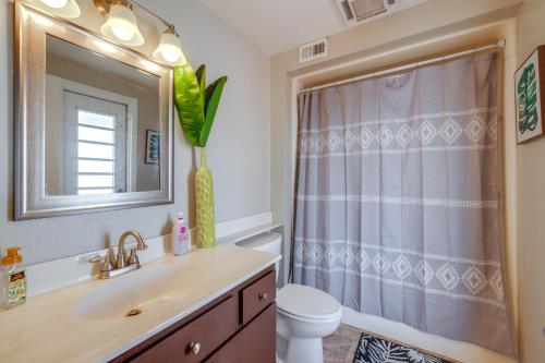 a bathroom with a sink and a shower curtain at Walk to Golf Club Sun City Home with Private Pool! in Sun City