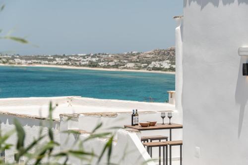 a view of the beach from the balcony of a house at FK Luxury Suites - Orkos Beach in Mikri Vigla