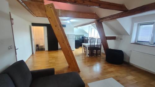 a living room with a couch and a table at Symbiola River Apartments in Děčín