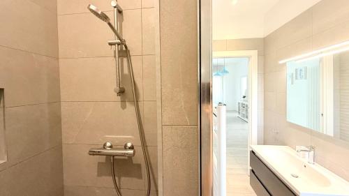 a shower with a glass door in a bathroom at S270 - Sirolo, quadrilocale in centro con vista panoramica in Sirolo