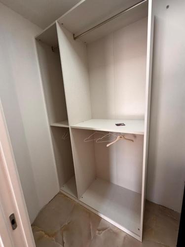 a walk in closet with white closets at Casa Florean in Cicciano