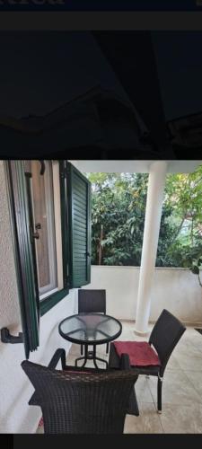 a patio with a table and two chairs and a table and chairs at Laguna in Donji Štoj