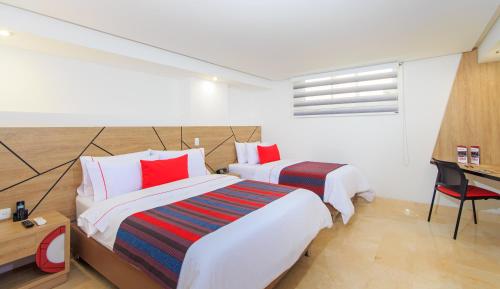 Una cama o camas en una habitación de Obo Hotel