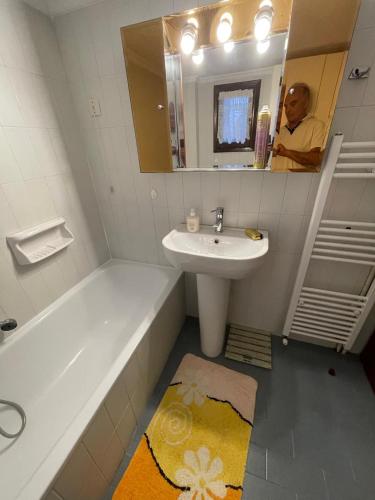 a man taking a picture of a bathroom at Aelia Seaside Maisonette in Neoi Epivates