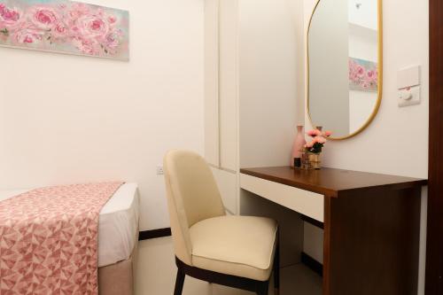 a room with a desk and a mirror and a chair at Trizen Colombo Luxury 3BR Smart Apartment with Breathtaking Views & Designer Furnishings in Colombo