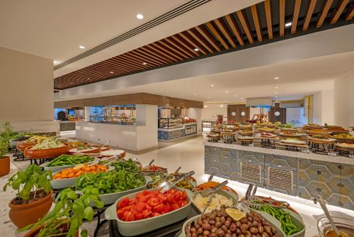 a buffet line with many different fruits and vegetables at Liberty Signa in Fethiye