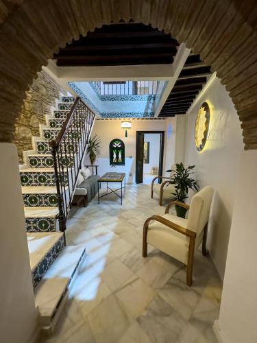 a hallway of a house with a spiral staircase at Maison Mouna in Tangier