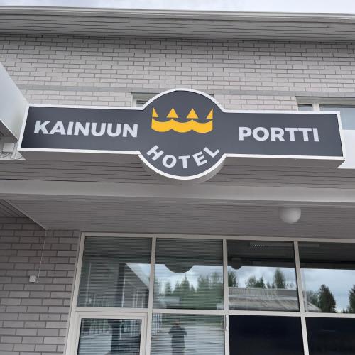 a sign on the front of a store at Hotelli Kainuunportti in Kajaani