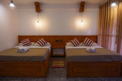 Postel nebo postele na pokoji v ubytování Ollie resort