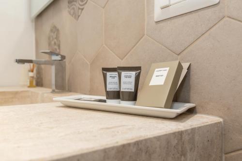 a counter with two cups on a box on it at Aras Hotel Boutique in Villasimius