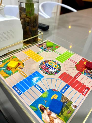 a board game on a glass table at The Almas Apartment in Willemstad