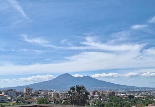 a view of a mountain in a city with buildings at Casa Helvius - Dimora in centro storico in Sant'Egidio del Monte Albino
