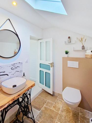 a bathroom with a sink and a toilet at Kerinou in Guimaëc