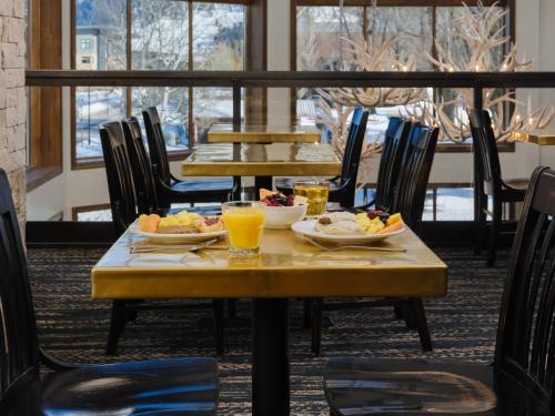 a table with plates of food and drinks on it at The Rockwell Inn in Jackson