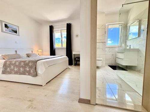 Posteľ alebo postele v izbe v ubytovaní Apartment Elza