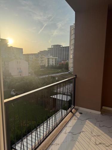 a balcony with a view of a city at Sea Apartment in Lezhë
