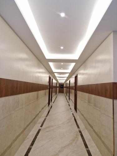 a corridor in a building with a hallway at Le Royal Suite in Udumalaippettai