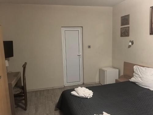 Ένα ή περισσότερα κρεβάτια σε δωμάτιο στο Hotel Zora