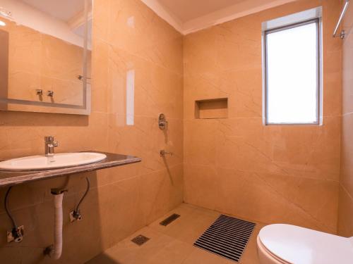 a bathroom with a sink and a toilet at Moustache Hostel Pahalgam in Pahalgām