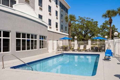 a swimming pool in front of a building at Holiday Inn Express St. Petersburg North / I-275 by IHG in St. Petersburg