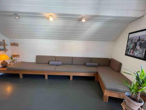 a living room with a couch in a room at Central apartment with a loft in the middle of Egersund city center in Egersund