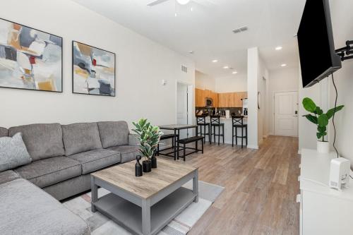 a living room with a couch and a table at Orlando 2BR Retreat 3 Beds Near Disney&Universal in Orlando