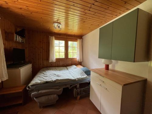 Un ou plusieurs lits dans un hébergement de l'établissement Appartement avec jardin au coeur de la nature