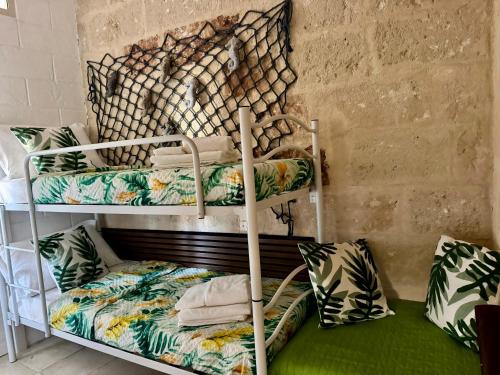 a room with two bunk beds in a room at Dimora Marina in Monopoli