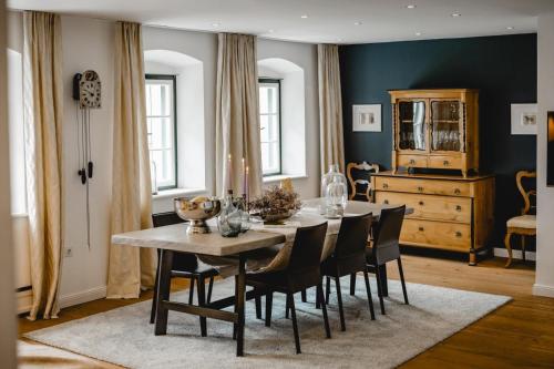 a dining room with a table and chairs at Waldach Villa in Thalgau