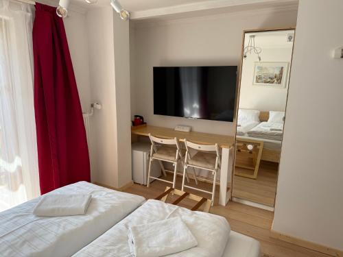 Postel nebo postele na pokoji v ubytování Seehotel am Hallstättersee