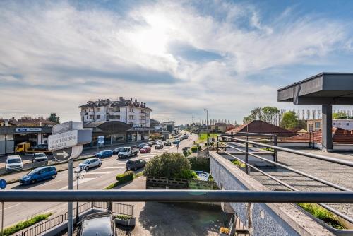 a busy city street with cars on the road at three-room apartment with terrace Free Wifi in Bareggio