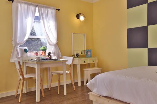 Una cama o camas en una habitación de Gyeongju Tiamo Pension