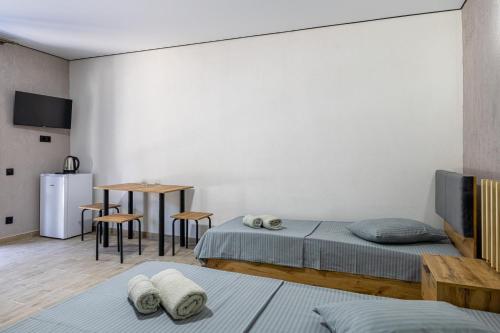 Кровать или кровати в номере OASIS Hotel NEW 2025
