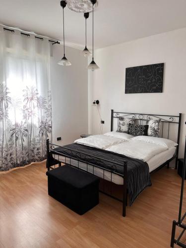 a bedroom with a large bed in a room at Oma Margareta Apartment in Limone sul Garda