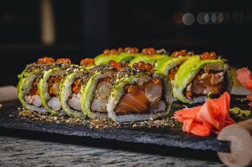a pile of sushi sitting on top of a table at Ocean Boulevard in Iquique