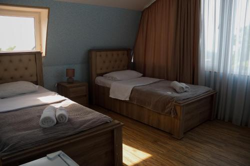 Una cama o camas en una habitación de Hotel Ziari