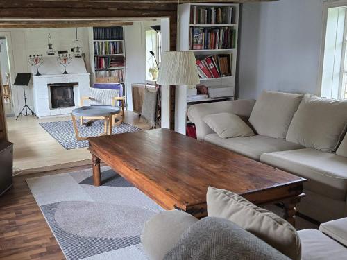 a living room with a couch and a coffee table at 4 star holiday home in Åsa in Åsa